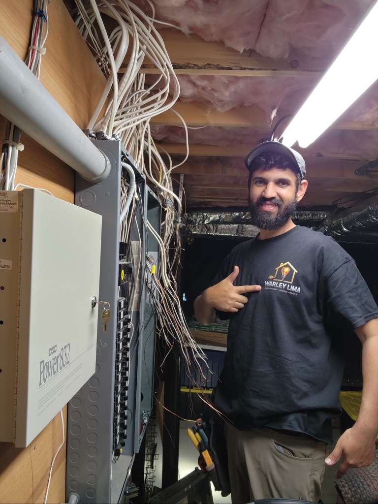 Warley Lima, licensed electrician, on the job